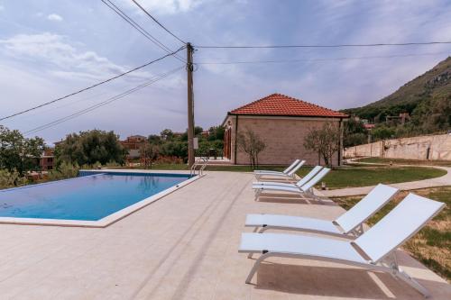 Sun loungers alongside the shared infinity pool